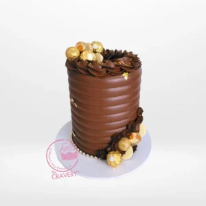Chocolate Explosion Cake by The Cravery | Birthday Cakes Solihull Luxurious chocolate explosion cake topped with assorted chocolates, handcrafted by The Cravery Cake Shop in Birmingham.