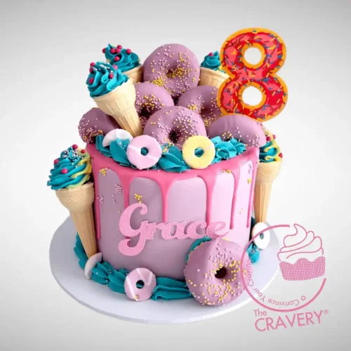 Colourful Doughnut Birthday Cake with buttercream-filled ice cream cones crafted by The Cravery, the best cake shop in Birmingham city centre.