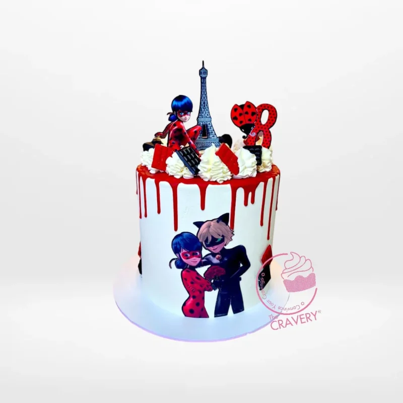 Red and black ladybug-themed cake with edible and non-edible prints from The Cravery Cake Shop in Shirley.