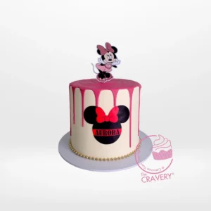 Minnie Mouse Birthday Cake by The Cravery | Cake Makers Birmingham Minnie Mouse Birthday Cake with pink polka dots and Minnie bow by The Cravery, expert cake makers in Birmingham.