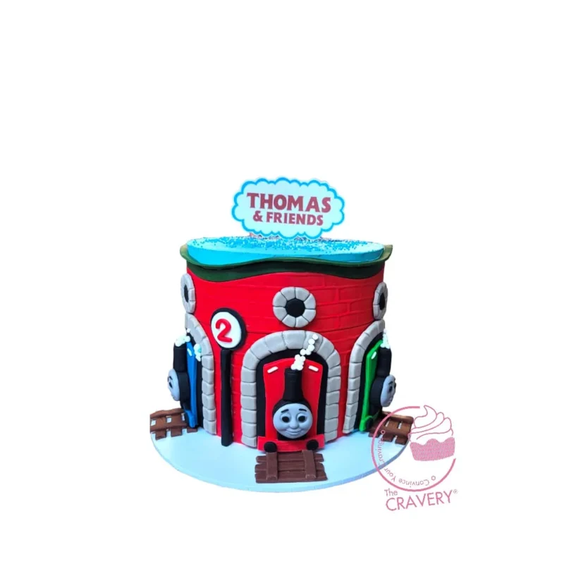 Thomas the Tank Cake from Cravery's Cake Makers Solihull. A fun and delicious cake for any Thomas the Tank fan’s celebration. Thomas the Tank Cake from Cravery's Cake Makers Solihull. A fun and whimsical cake perfect for Thomas the Tank Engine-themed celebrations.
