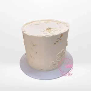 White on White Cake – Custom cake for elegant celebrations in Birmingham. White on White Cake – A custom cake with intricate white decorations, available at our cake shop Birmingham.
