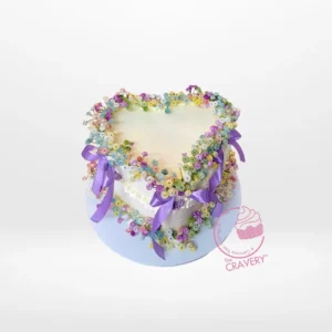 Cake Shaped Heart – A heart-shaped cake with buttercream frosting and fondant decorations, perfect for romantic celebrations in Birmingham.