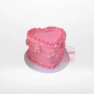 Shaped Heart Cake – Romantic heart-shaped cake for celebrations in Birmingham. Shaped Heart Cake – A romantic heart-shaped cake with buttercream frosting and fondant decorations, perfect for celebrations in Birmingham.