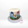 Babyshark Cake with Waves, themed blue cake with sea-inspired decorations and Baby Shark characters, from the best cake shop in Birmingham