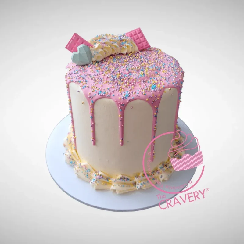 Pink Sprinkle Cake by The Cravery | Cake Delivery Birmingham Pink Sprinkle Cake with white chocolate ganache and colourful sprinkles, handcrafted by The Cravery for cake delivery Birmingham.