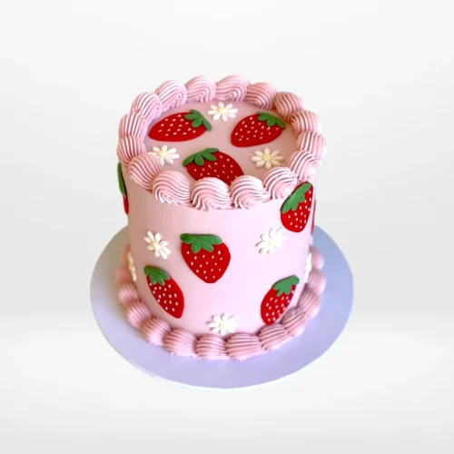 Cake with fondant strawberry decoration and smooth buttercream finish, handcrafted in Birmingham.