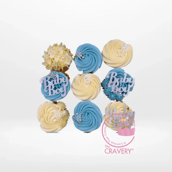 Babyshower Cupcakes for Boy by The Cravery, blue and white cupcakes with buttercream frosting and baby-themed decorations, baked fresh in Birmingham.