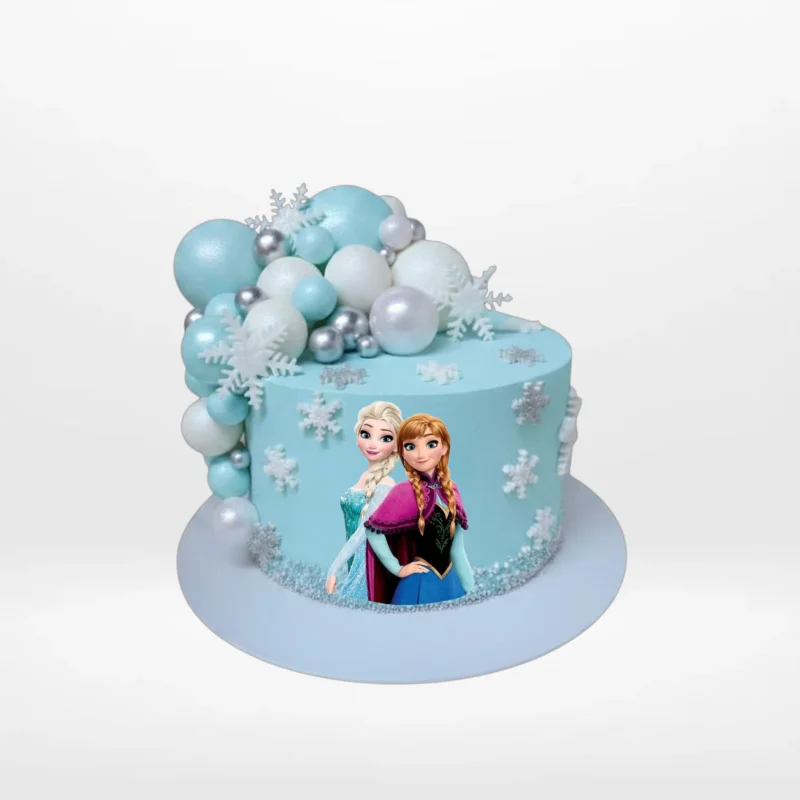 Frozen Cake by The Cravery | Cake Shop Birmingham Frozen Cake decorated with Disney Frozen miniatures handcrafted by The Cravery, cake shop Birmingham.