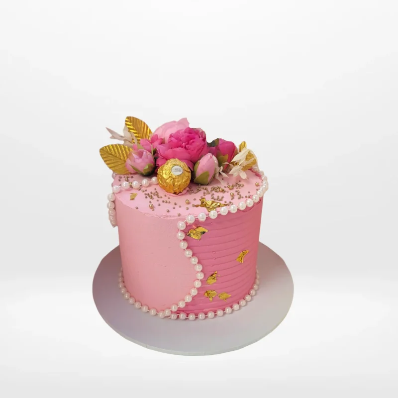 Pink Cake Birmingham Pink celebration cake with smooth buttercream finish made in Birmingham.