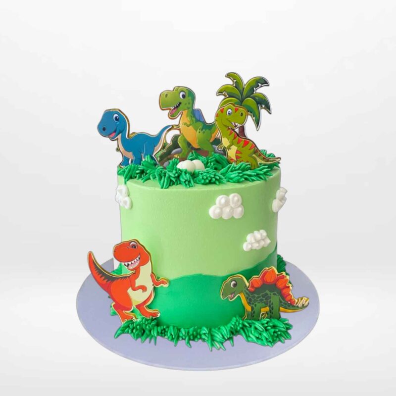 Simple Dinosaur Cake by The Cravery | Birthday Cakes Delivered Birmingham Simple Dinosaur Cake with non-edible dinosaur topper handcrafted by The Cravery, available for birthday cakes delivered in Birmingham.