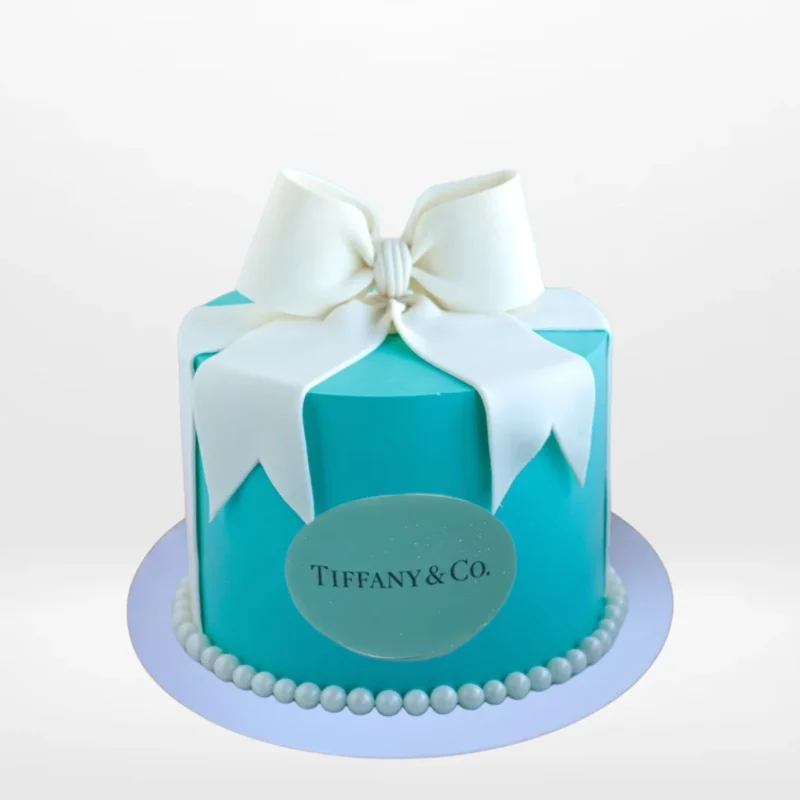 Tiffany Blue Cake by The Cravery | Cake Walsall Elegant Tiffany Cake in signature blue with white ribbon and bow, handcrafted by The Cravery Cake Shop Walsall.