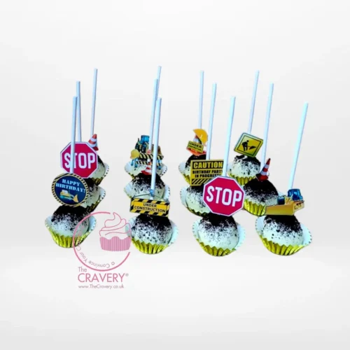 Construction themed cake and pop digger set with edible soil and digger decorations, available for cake delivery in Birmingham.