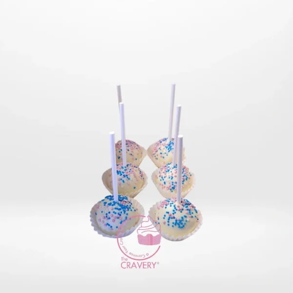 Gender reveal cake pop with pink or blue filling, handcrafted at a cake shop in Moseley.