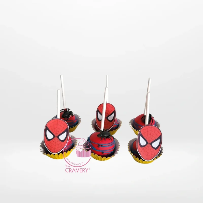Pop Cakes Spiderman, Cake Shop Handsworth pop cakes Spiderman themed with red and blue character decoration from a cake shop in Handsworth.