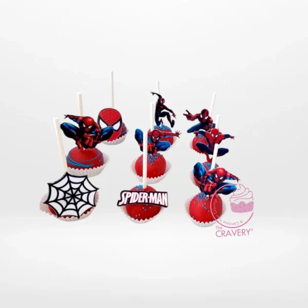 Spiderman themed cake pops with red and blue colours and web design, handcrafted at a cake shop in Great Barr.