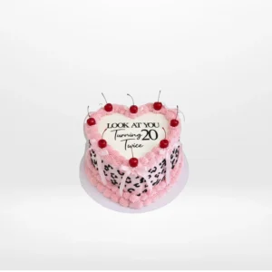 Forty birthday cake with elegant decorations and number 40 topper.